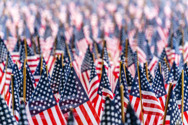 field of US flags to commemorate Memorial Day in Boston, MA