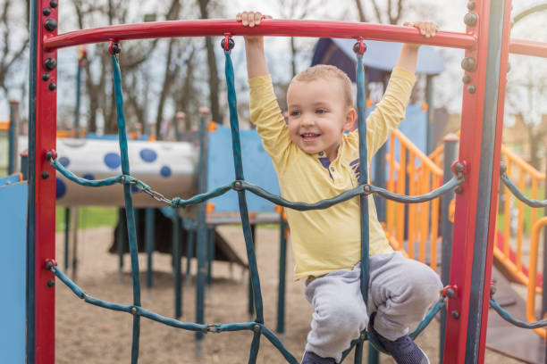 istock Adorable little boy with blue eyes having fun outdoor 963283882