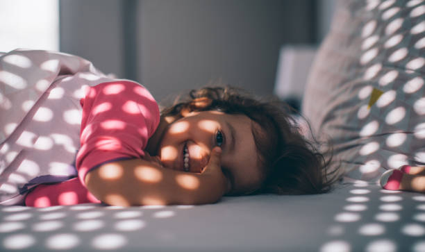 istock Baby girl in bed 963291332