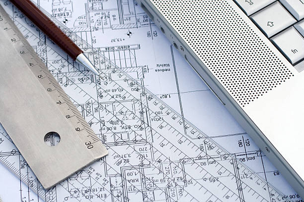 istock Laptop and rulers on a blueprint 96329508