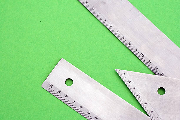istock Metal rulers on a green paper 96329515