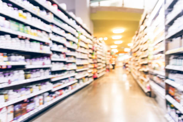 istock Vintage blurred probiotics and multi vitamins at grocery store in USA 963298228
