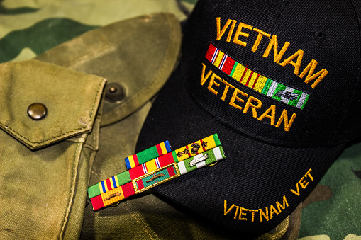 Vietnam Veterans Hat, Service Ribbons & Pouches On Camouflage Uniform