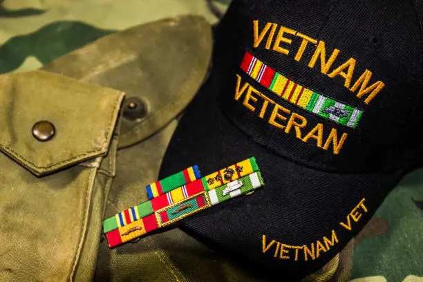 Vietnam Veterans Hat, Service Ribbons & Pouches On Camouflage Uniform