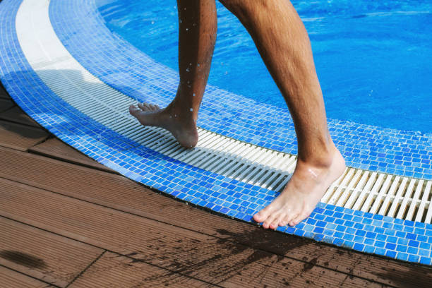 istock Legs of a man on the swimming 963317608