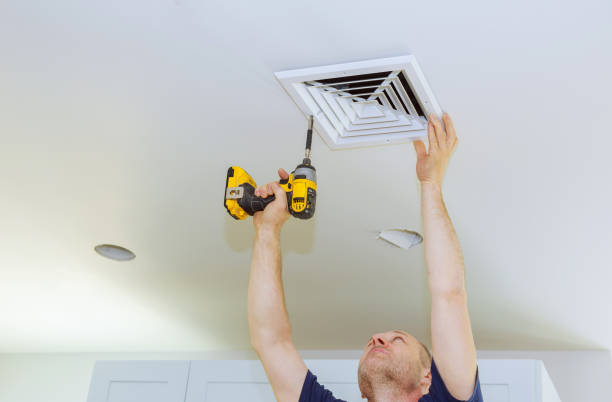 istock Man installing of HVAC, heating ventilating and cooling after replacing the air filter. 963318696
