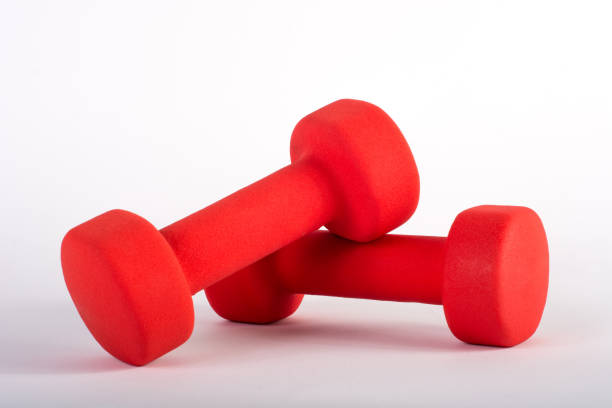 istock Red dumbbell for fitness isolated on white background 963345046