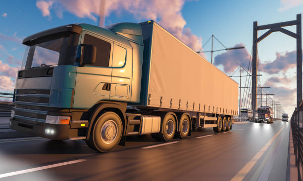 istock Semi Trailer Truck with Other Vehicles Moving on Bridge 963345466