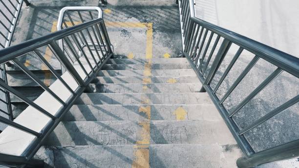 istock Staircase cement and stainless steel railing 963346462