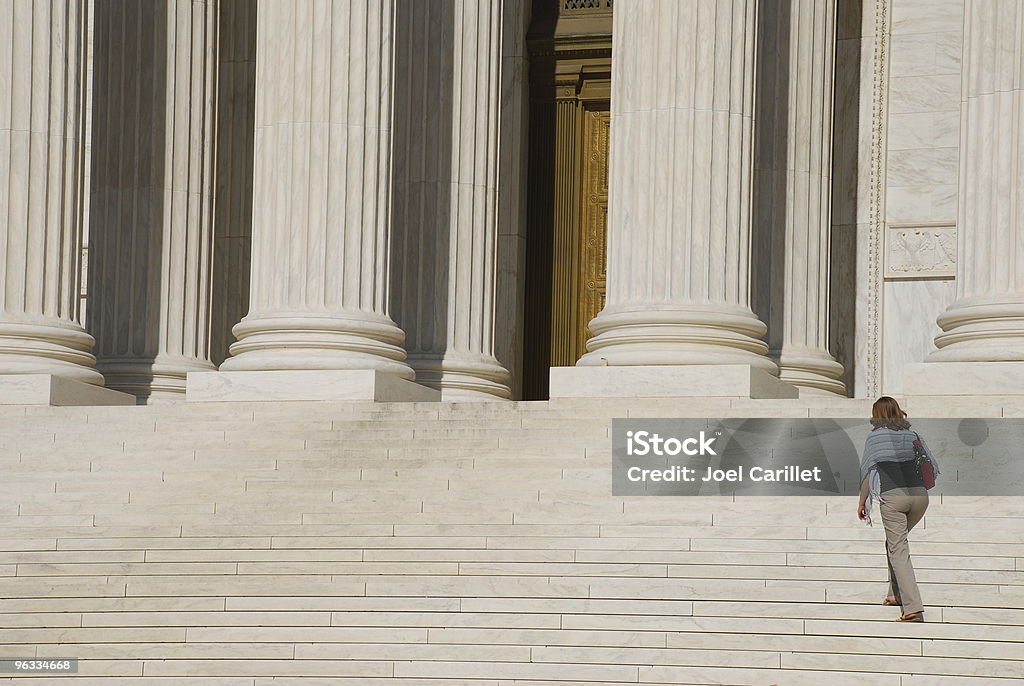 Woman walking up Steps of US Supreme Court The US Supreme Court in Washington DC.  Lawyer Stock Photo