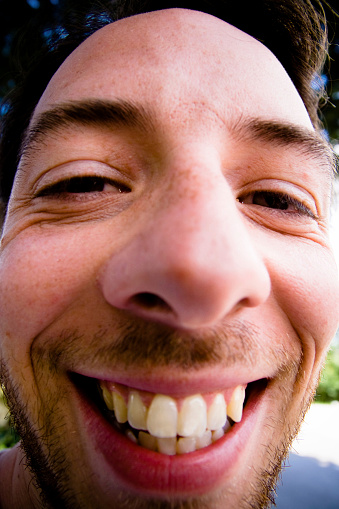 Ugly happy man close-up. With fisheye.