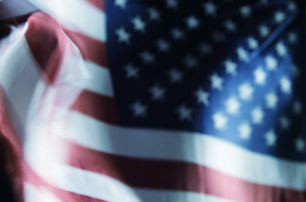 istock American Flag Flying in Night Wind 963350632