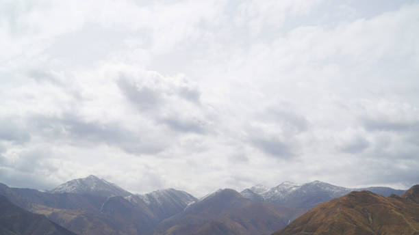 istock Mountain with some cloud on the blue clear sky 963355602
