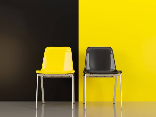 istock Two chairs in front of black and yellow wall 963362186