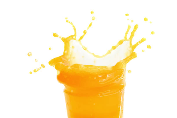 istock Orange juice splashing isolated on a white background 963362782