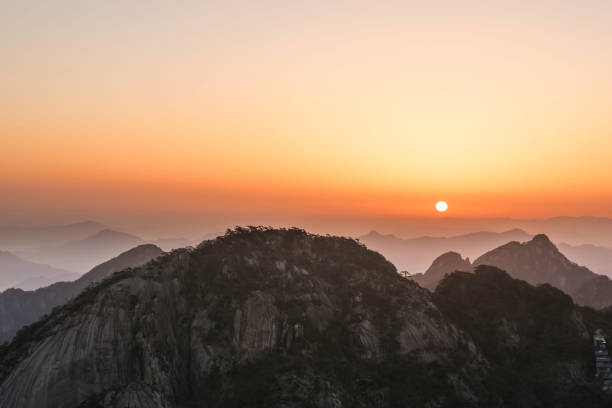 istock Sunrise in Huangshan mountains 963366098