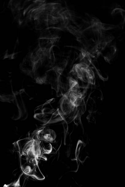 istock Movement of white smoke isolated on black background. 963367420