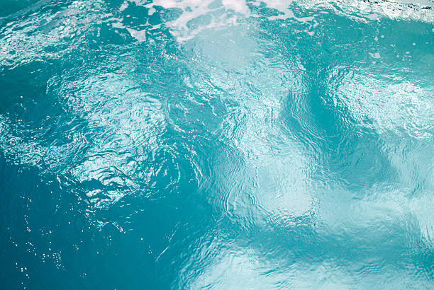 A close up image of a hot tub with blue water http://www.istockphoto.com/file_thumbview_approve.php?size=2&id=2266748 jacuzzi water stock pictures, royalty-free photos & images