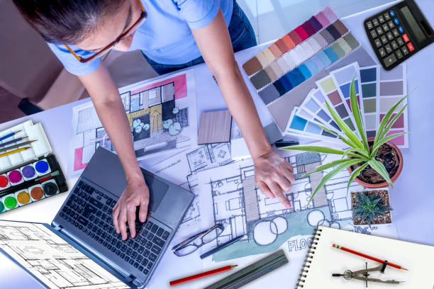 istock Architect, interior designer working at office table / Home renovation & decoration conceptual 963370234