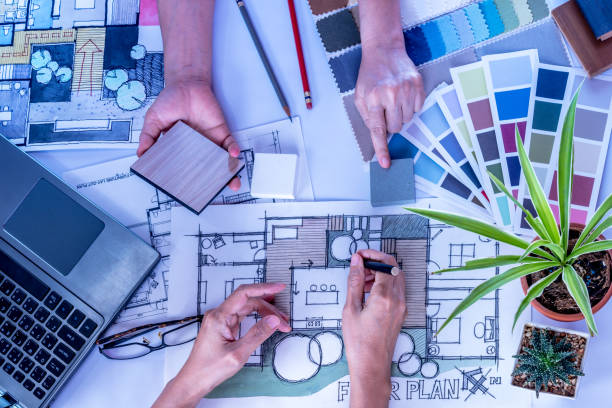 istock Architect, interior designer working at office table / Home renovation & decoration conceptual 963370366
