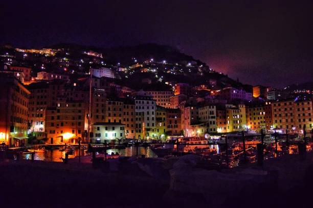 Italian village lit up An Italian Village on the riviera coast lights up at night bringing out the beautiful colors of the buildings kantor stock pictures, royalty-free photos & images