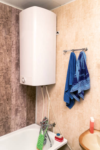 Home electric or gas water heater in the bathroom Home electric or gas water heater in the bathroom. Geyser bathroom geyser stock pictures, royalty-free photos & images