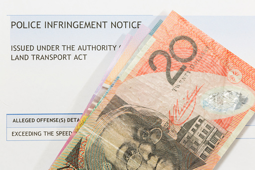 Australia Import Export Trading Concept with a Australian Flag Covered Shipping Container and Forlift Lifting Cargo Boxes on Australian Dollar Banknotes. 3D Render