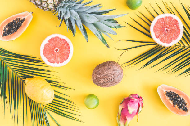 istock Tropical palm leaves, pineapple, coconut, papaya, dragon fruit, orange 963390758