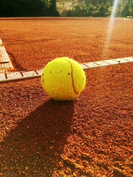 istock Tennis ball on service line 963392294