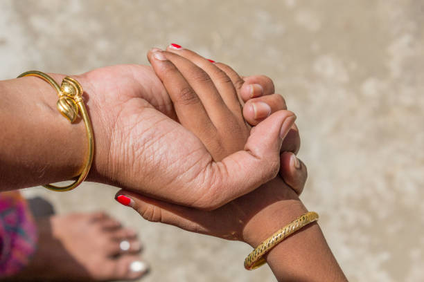 istock an indian mother seen safely holding her daughter 963403486