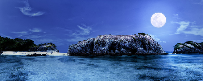 Panoramic landscape of Cockburn islands Myanmar at full moon night with clear blue sea and clear sky and full moon shining