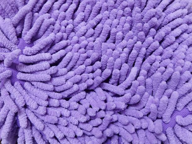 istock Detail of Purple Fluffy Fabric Texture Background 963407544