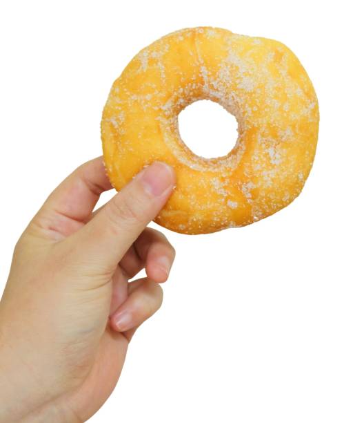 istock Hand Holding Delicious Glazed Donut with Sugar 963407764