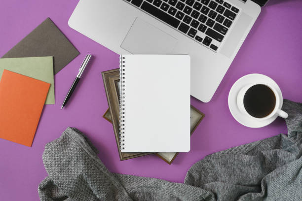 Home office work space on violet background.