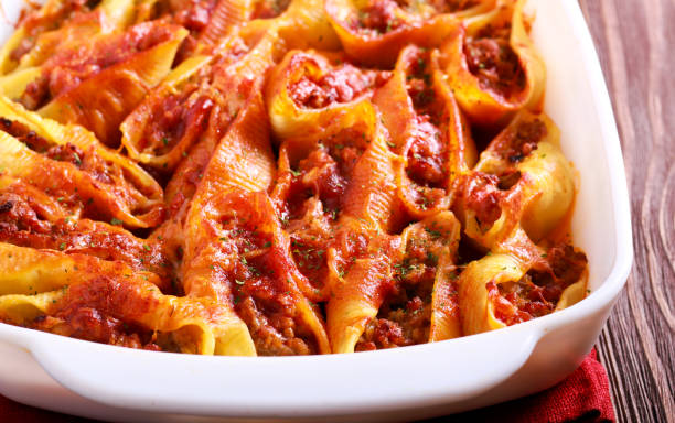 istock Pasta shell stuffed with mincemeat in tomato sauce 963416892