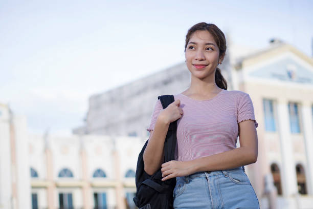 istock Smiling lady student in the school campus. 963421108