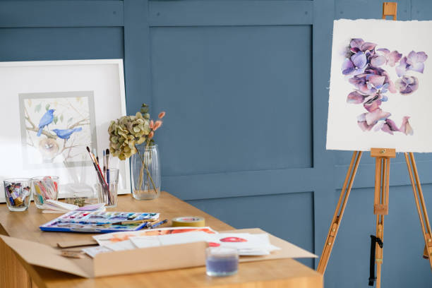 istock artist painting workspace tools watercolor easel 963427136
