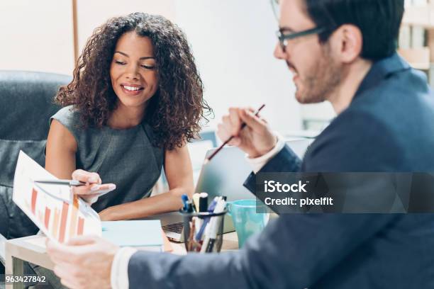 Discussing The Market Research Stock Photo - Download Image Now - Market Research, Business, African-American Ethnicity