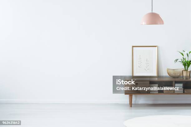 Pink Lamp Above Wooden Sideboard Stock Photo - Download Image Now - Living Room, Wall - Building Feature, Domestic Room