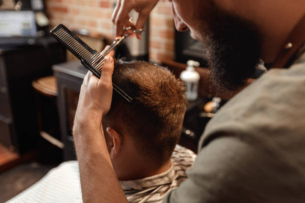 istock Barber and bearded man in barber shop 963431758