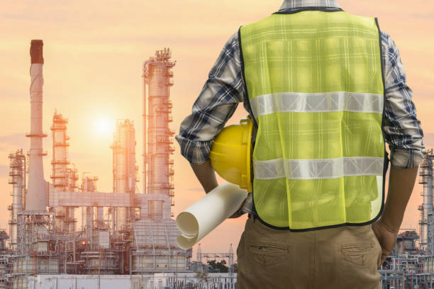 istock Engineer or Safety officer holding hard hat with the mobile crane machine is background in construction site, Civil construction engineering concept 963432204