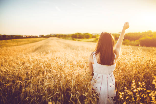 istock A happy young woman in the wheat field. 963433514