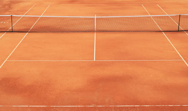 istock Clay tennis court with net 963433912