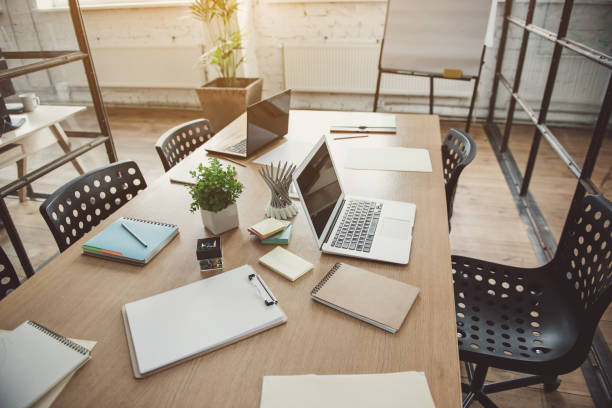 istock Gadgets and exercise books on desk 963433956
