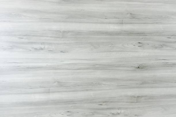 istock wood texture background, light weathered rustic oak. faded wooden varnished paint showing woodgrain texture. hardwood washed planks pattern table top view. 963442818