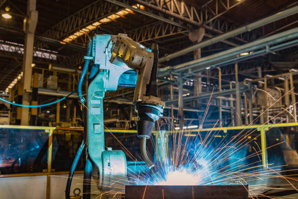 istock Industrial robot is welding in factory 963443482