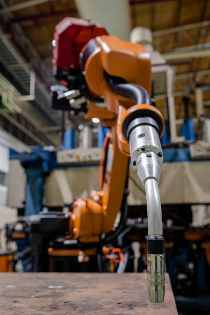 istock Close-up torch body of robot auto welding 963443514