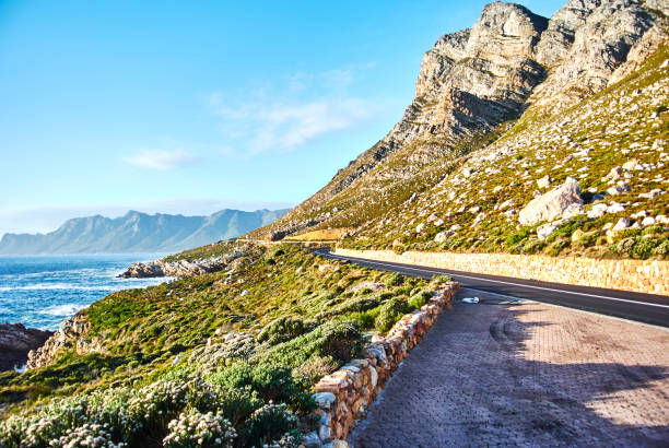 istock Seaside road at sunset Boland Mountain Complex, Western Cape 963447608