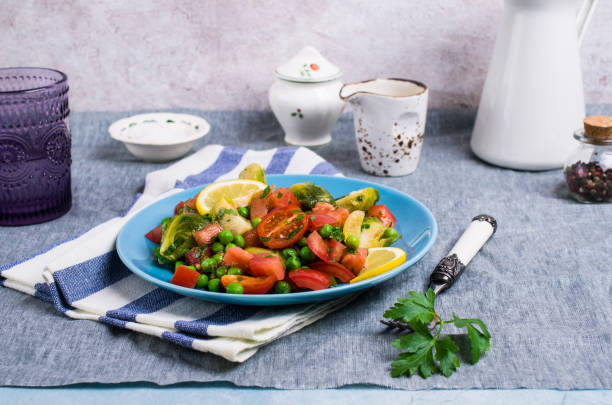 Salad with raw slices of vegetables Salad with raw slices of vegetables in a dish on the table. Selective focus. kosher starter recipes stock pictures, royalty-free photos & images
