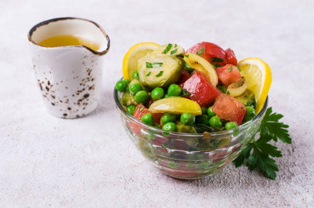 Salad with raw slices of vegetables Salad with raw slices of vegetables in a dish on the table. Selective focus. kosher starter recipes stock pictures, royalty-free photos & images